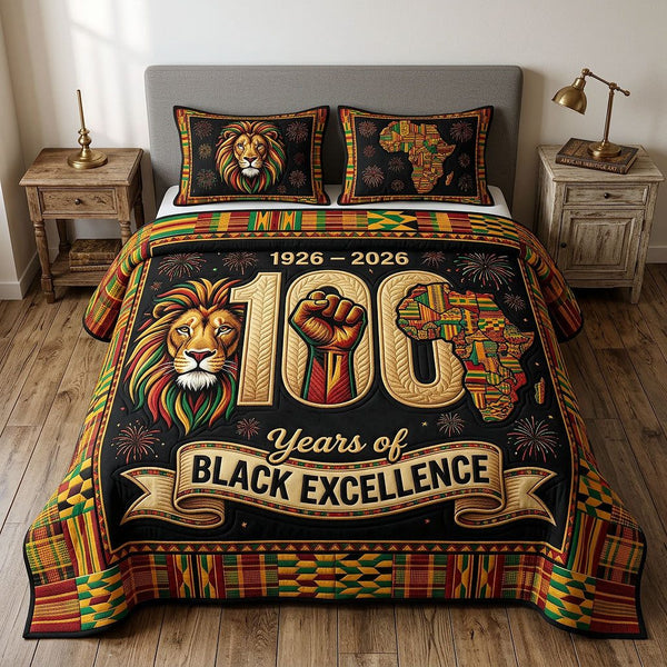 Melanin Legacy quilted 3-piece bedding set on a made bed with two matching pillow shams