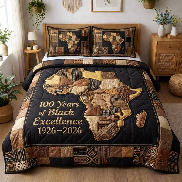 Melanin Magic quilted 3-piece bedding set on a made bed with two matching pillow shams