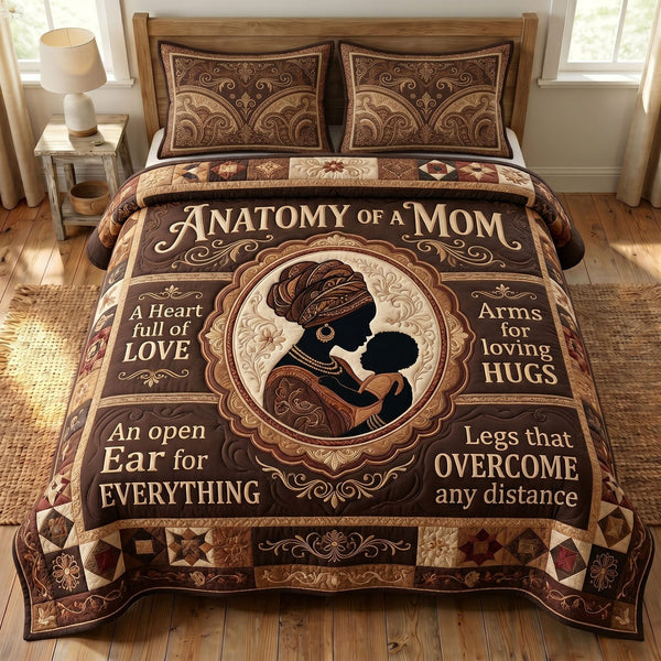 Melanin Queen quilted 3-piece bedding set on a made bed with two matching pillow shams