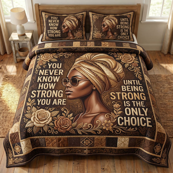 Melanin Queen quilted 3-piece bedding set on a made bed with two matching pillow shams