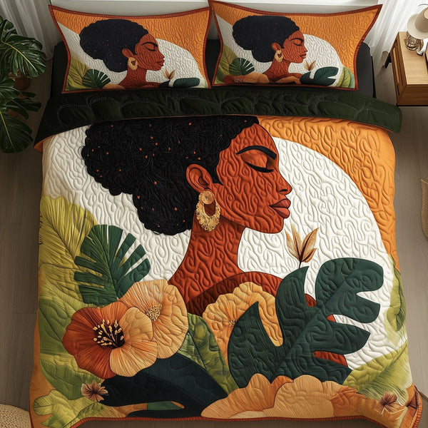 Melanin quilted 3-piece bedding set on a made bed with two matching pillow shams