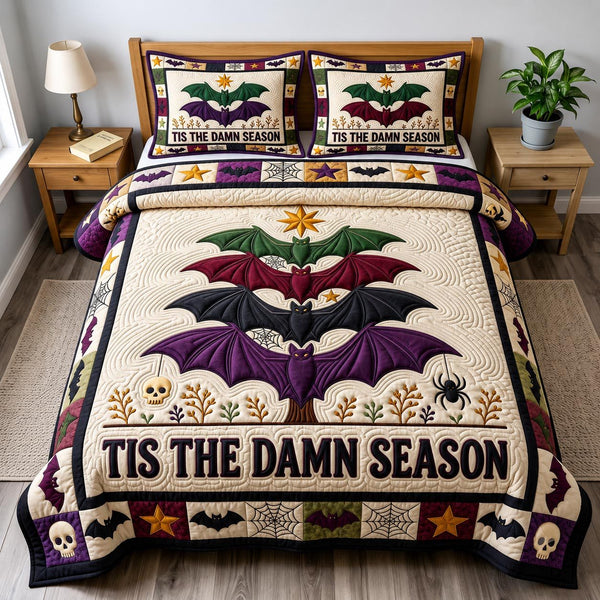 Merry Gothmas quilted 3-piece bedding set on a made bed in a winter-styled bedroom