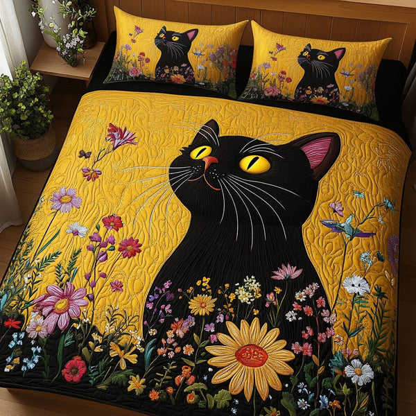 Midnight Bloom quilted 3-piece bedding set on a made bed with two matching pillow shams