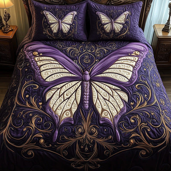Midnight Butterfly quilted 3-piece bedding set on a made bed with two matching pillow shams