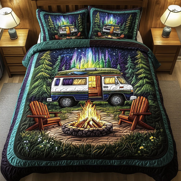 Midnight Camping quilted 3-piece bedding set on a made bed with two matching pillow shams