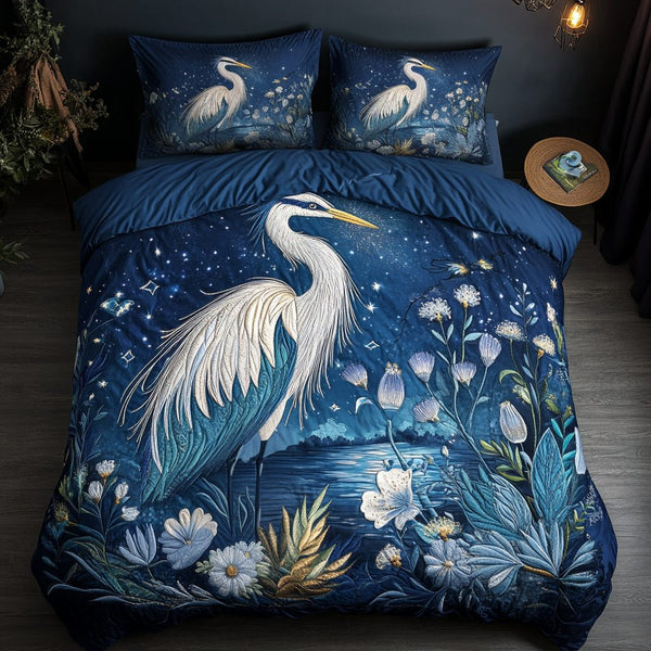 Midnight Heron quilted 3-piece bedding set on a made bed with two matching pillow shams