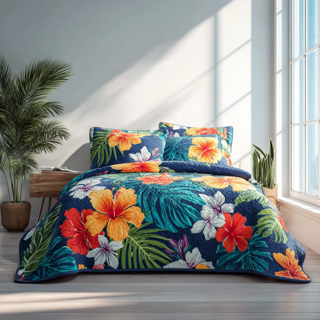 Midnight Hibiscus quilted 3-piece bedding set on a made bed with two matching pillow shams