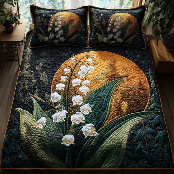 Midnight Lily Of The Valley quilted 3-piece bedding set on a made bed with two matching pillow shams