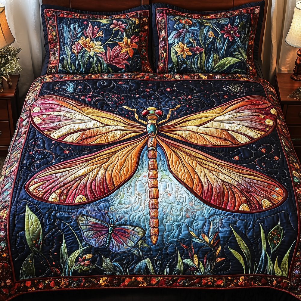 Midnight Mistique Dragonfly quilted 3-piece bedding set on a made bed with two matching pillow shams