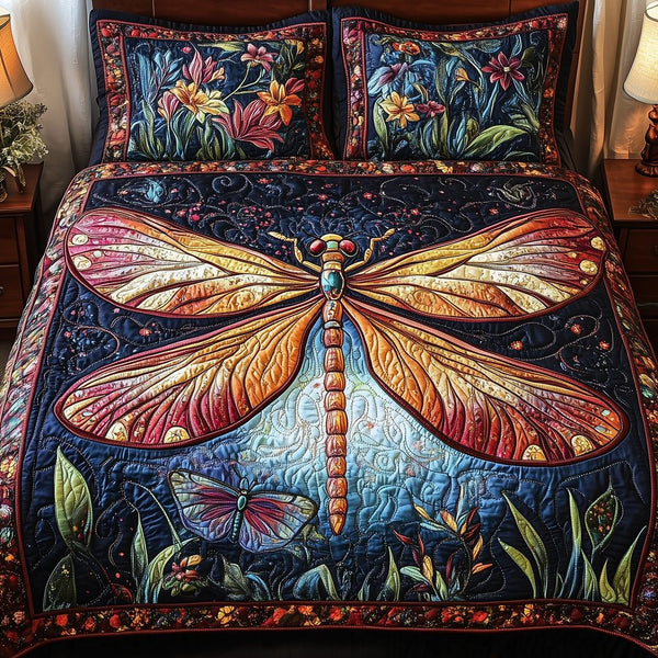 Midnight Mistique Dragonfly quilted 3-piece bedding set on a made bed with two matching pillow shams