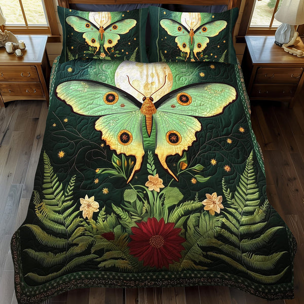 Midnight Moth quilted 3-piece bedding set on a made bed with two matching pillow shams