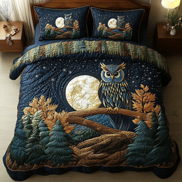 Midnight Owl quilted 3-piece bedding set on a made bed with two matching pillow shams