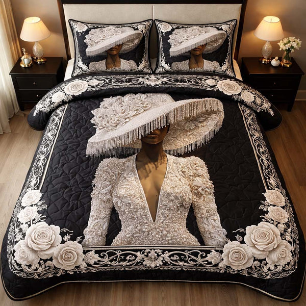 Midnight Pearl Muse quilted 3-piece bedding set on a made bed with two matching pillow shams