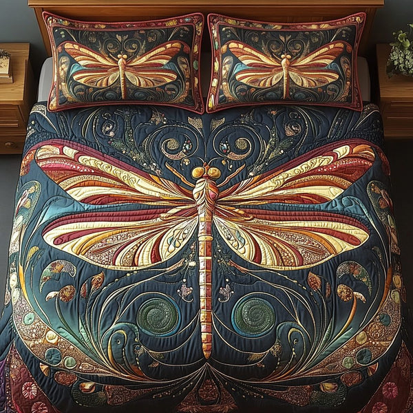 Midnight Serenity Dragonfly quilted 3-piece bedding set on a made bed with two matching pillow shams
