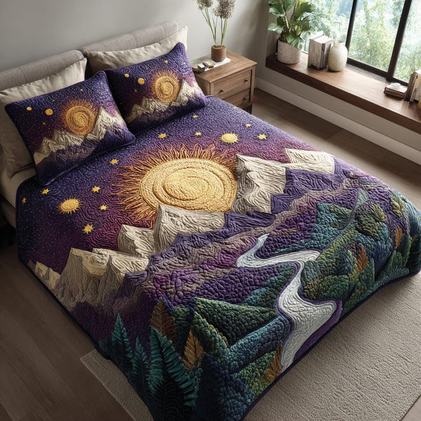 Midnight Sun Mountain quilted 3-piece bedding set on a made bed with two matching pillow shams