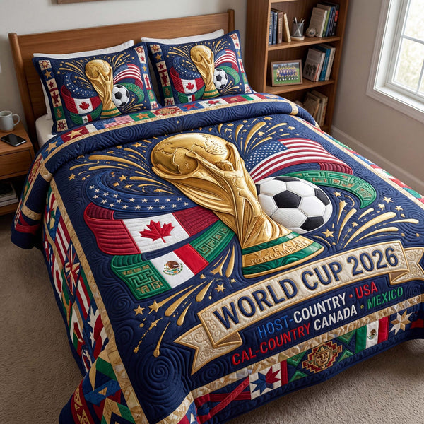Midnight Victory quilted 3-piece bedding set on a made bed with two matching pillow shams