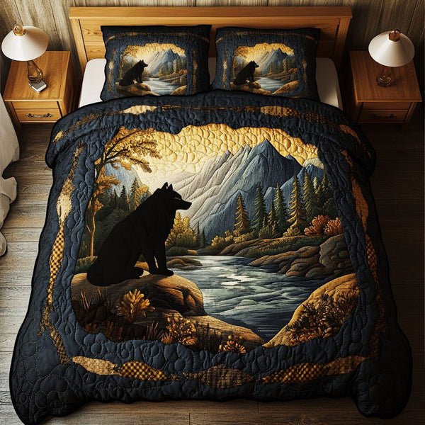 Midnight Wilderness quilted 3-piece bedding set on a made bed with two matching pillow shams
