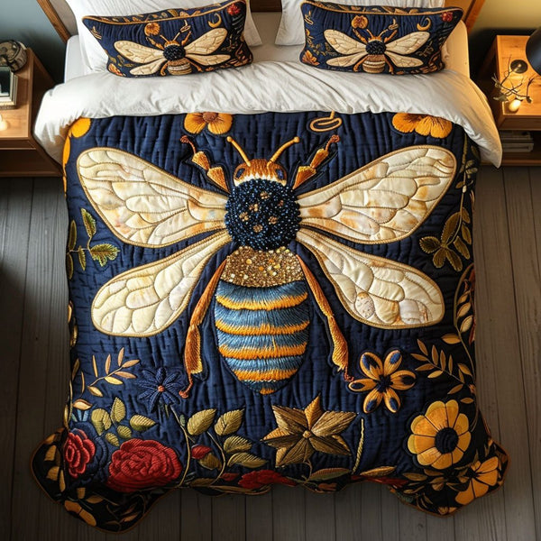 Midnight Wings quilted 3-piece bedding set on a made bed with two matching pillow shams