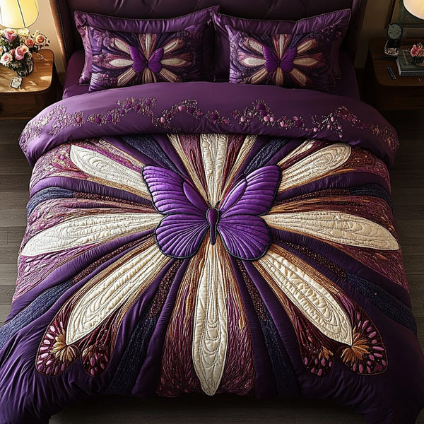 Midnight Wings quilted 3-piece bedding set on a made bed with two matching pillow shams