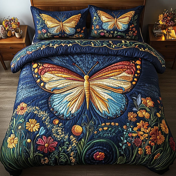 Midnight Wings quilted 3-piece bedding set on a made bed with two matching pillow shams