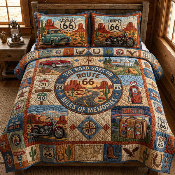 Miles Of Memories quilted 3-piece bedding set on a made bed with two matching pillow shams