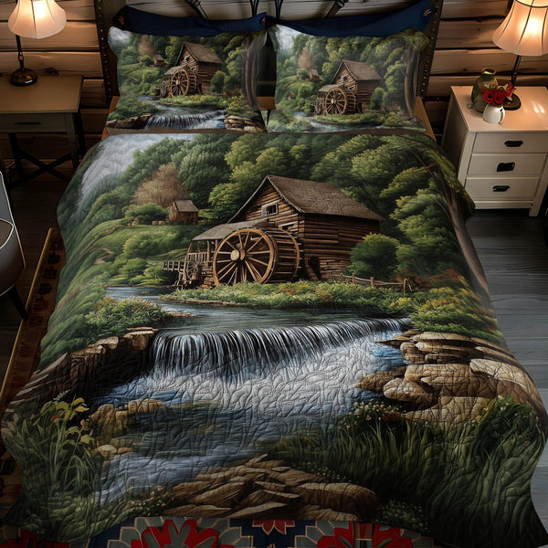 Mill Creek Falls quilted 3-piece bedding set on a made bed with two matching pillow shams