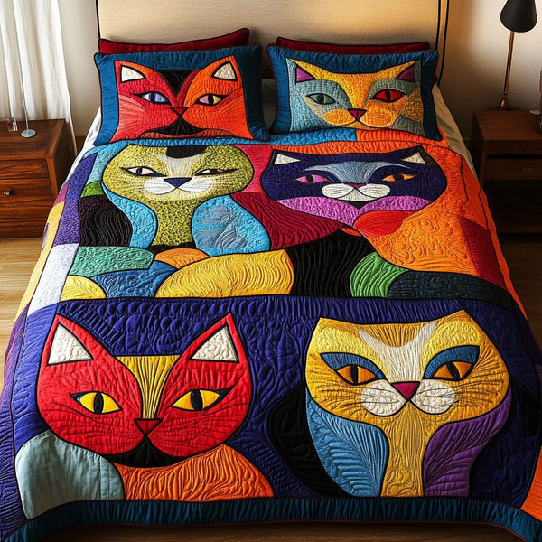 Mischief and Meows quilted 3-piece bedding set on a made bed with two matching pillow shams