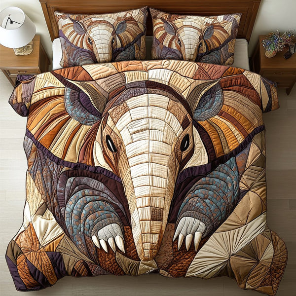 Modern Mosaic quilted 3-piece bedding set on a made bed with two matching pillow shams