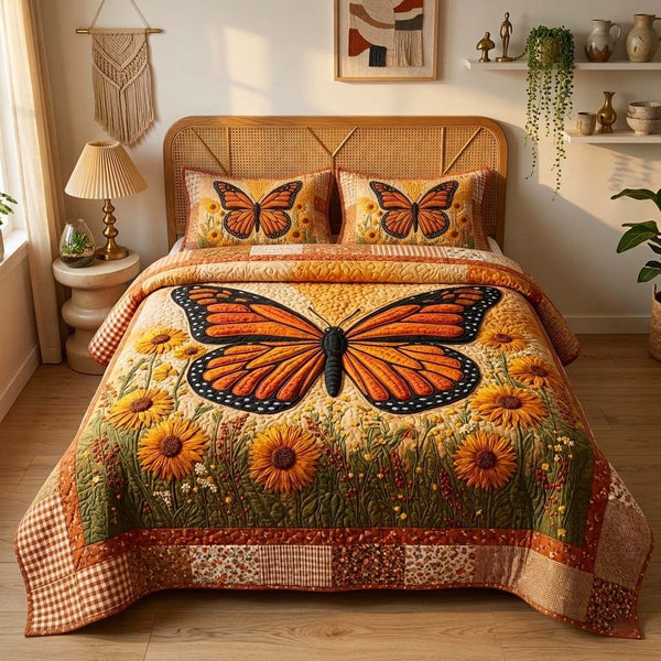 Monarch Bloom quilted 3-piece bedding set on a made bed with two matching pillow shams