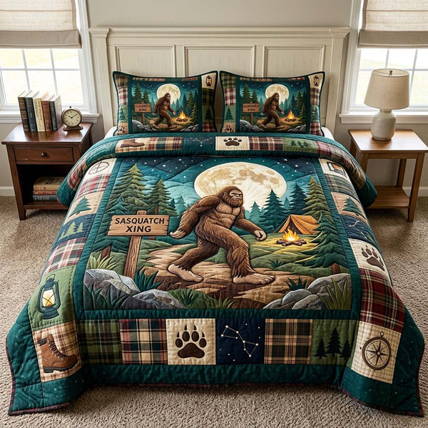 Moon Sasquatch quilted 3-piece bedding set on a made bed with two matching pillow shams