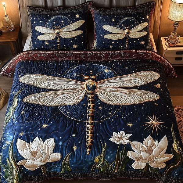 Moonlit Dragonfly quilted 3-piece bedding set on a made bed with two matching pillow shams