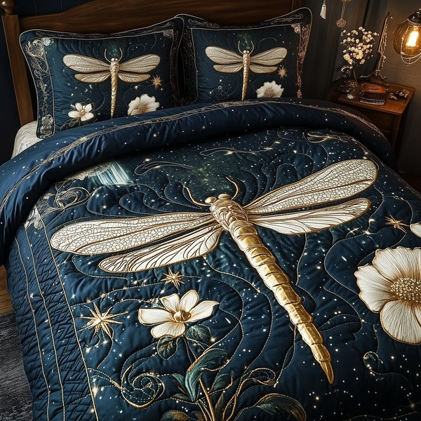 Moonlit Dragonfly quilted 3-piece bedding set on a made bed with two matching pillow shams