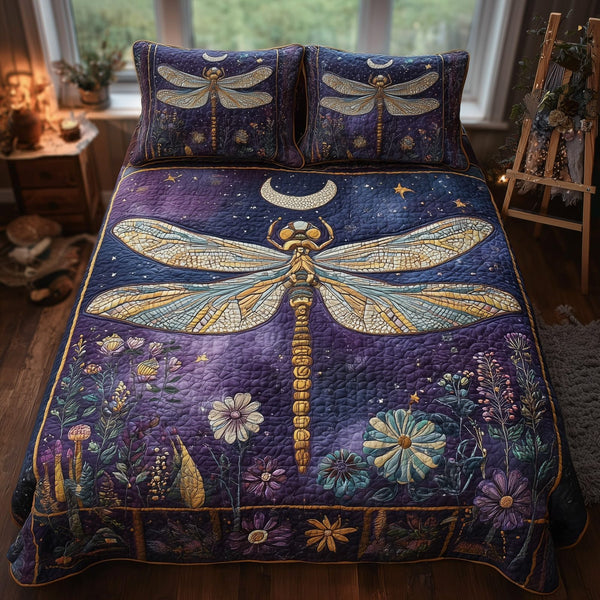 Moonlit Dragonfly quilted 3-piece bedding set on a made bed with two matching pillow shams
