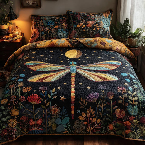 Moonlit Dragonfly quilted 3-piece bedding set on a made bed with two matching pillow shams