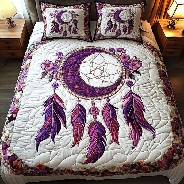 Moonlit Dream quilted 3-piece bedding set on a made bed with two matching pillow shams