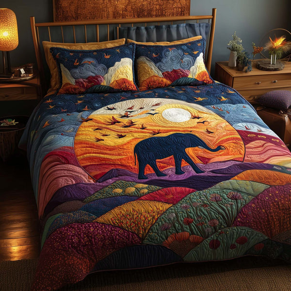 Moonlit Elephant quilted 3-piece bedding set on a made bed with two matching pillow shams
