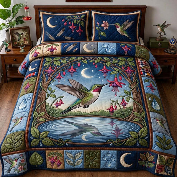 Moonlit Fuchsia Garden quilted 3-piece bedding set on a made bed with two matching pillow shams
