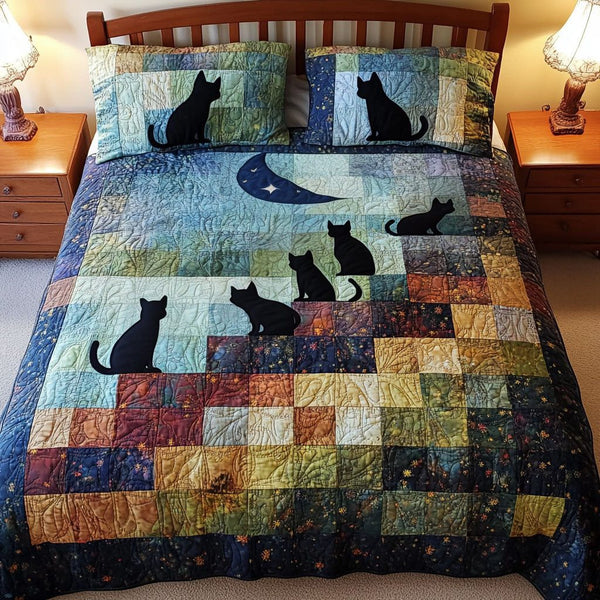 Moonlit Gathering quilted 3-piece bedding set on a made bed with two matching pillow shams