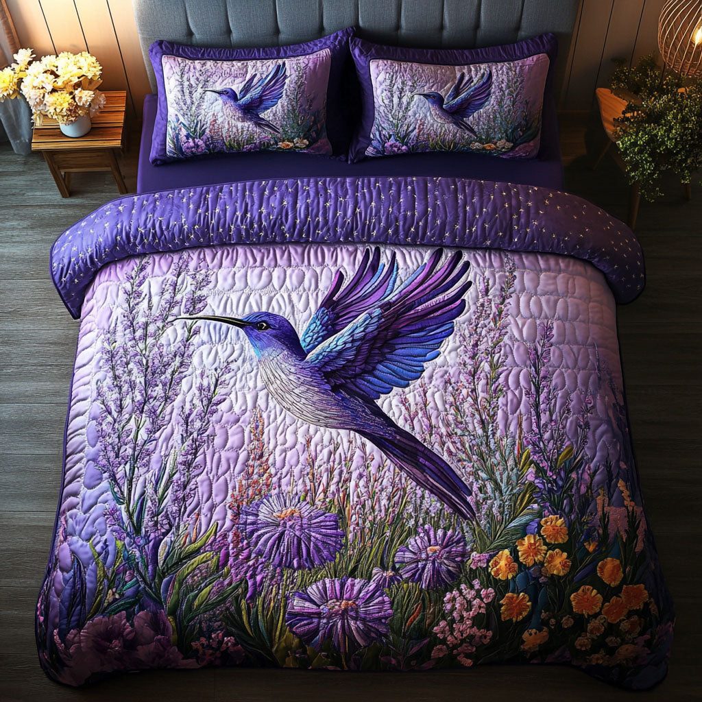 Moonlit Hummingbirds quilted 3-piece bedding set on a made bed with two matching pillow shams