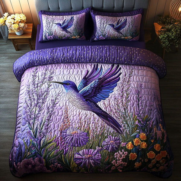 Moonlit Hummingbirds quilted 3-piece bedding set on a made bed with two matching pillow shams