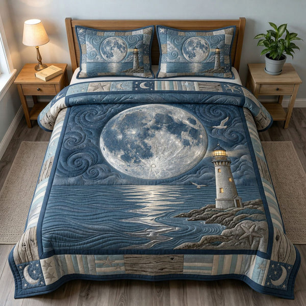 Moonlit Lighthouse quilted 3-piece bedding set on a made bed in a light coastal bedroom