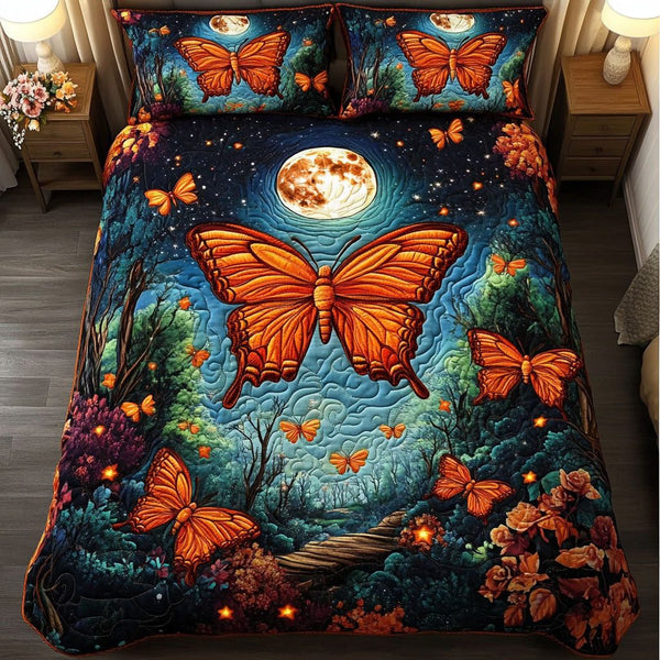Moonlit Monarch quilted 3-piece bedding set on a made bed with two matching pillow shams