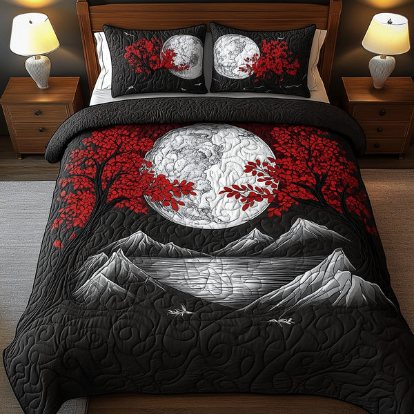 Moonlit Mystique quilted 3-piece bedding set on a made bed with two matching pillow shams