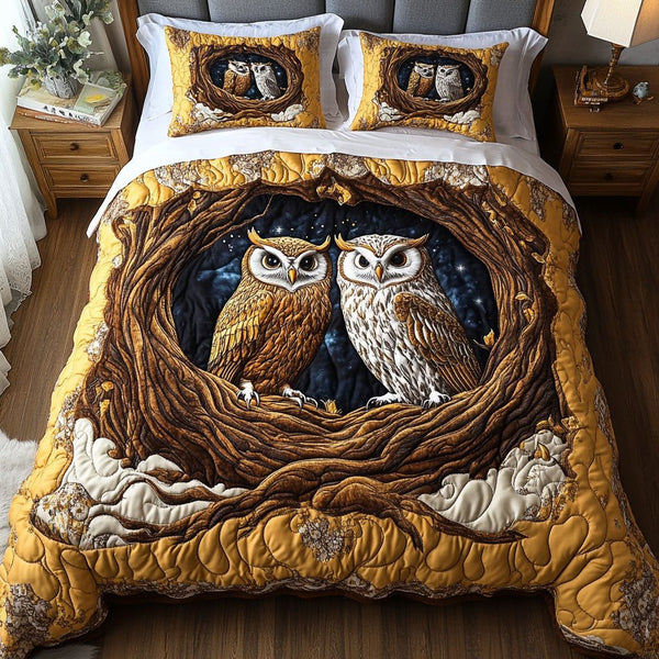 Moonlit Owls quilted 3-piece bedding set on a made bed with two matching pillow shams