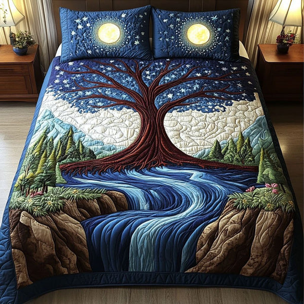 Moonlit River Tree quilted 3-piece bedding set on a made bed with two matching pillow shams