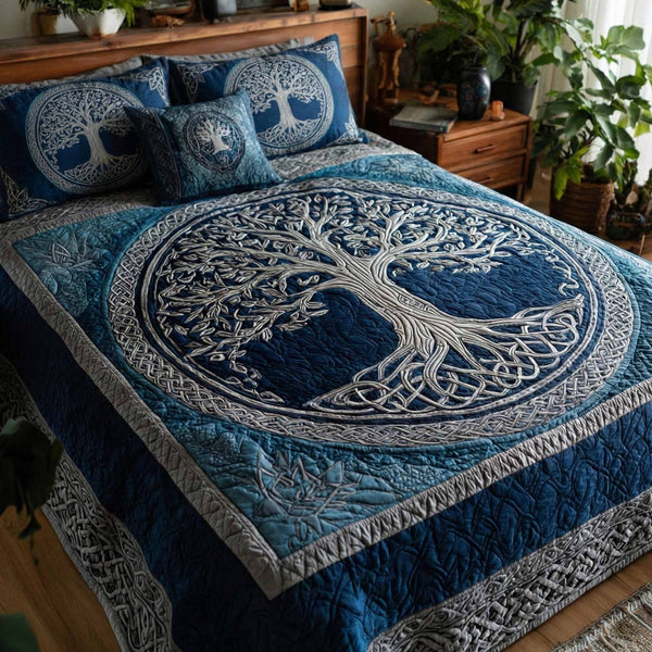 Moonlit Roots quilted 3-piece bedding set on a made bed with two matching pillow shams