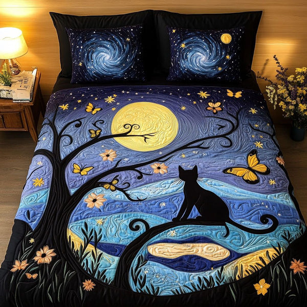 Moonlit Shadows quilted 3-piece bedding set on a made bed with two matching pillow shams