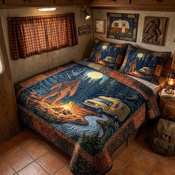 Moonlit Wanderer quilted 3-piece bedding set on a made bed with two matching pillow shams