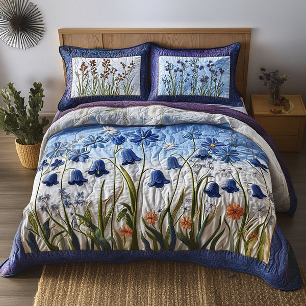 Morning Dew quilted 3-piece bedding set on a made bed with two matching pillow shams