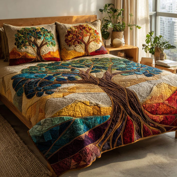 Mosaic Canopy quilted 3-piece bedding set on a made bed with two matching pillow shams
